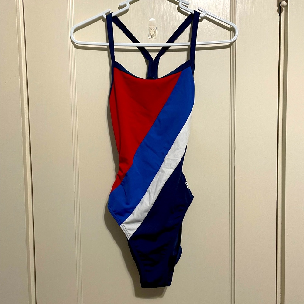 Form fitting ARENA racing swimsuit, red white and blue, open back